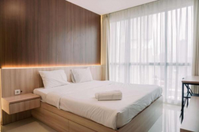 Spacious and Warm 2BR at Ciputra World 2 Apartment By Travelio